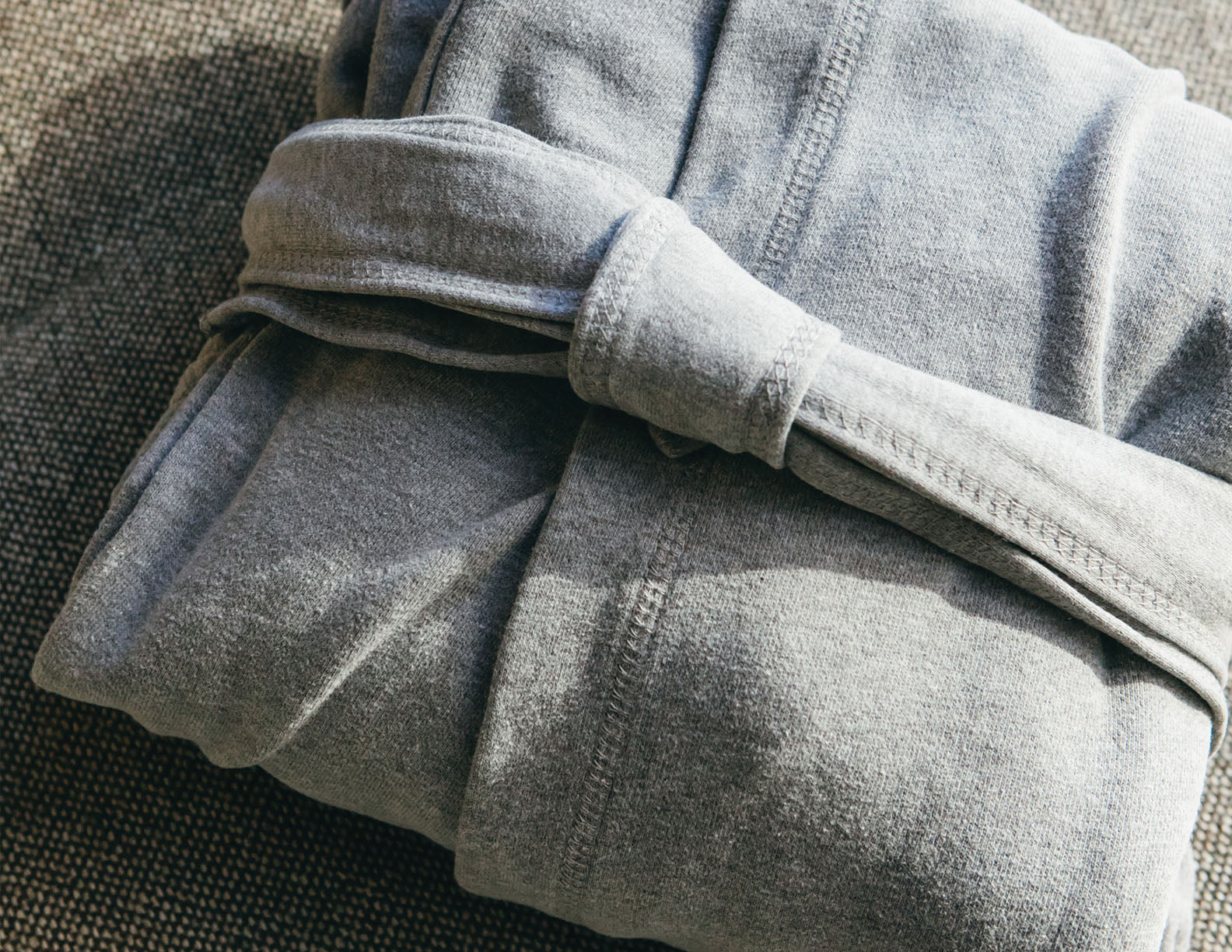 Close view of the Signature Robe's soft jersey-knit fabric and waist tie